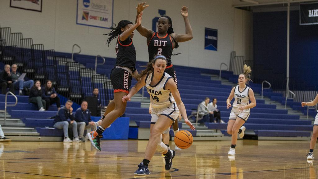 From left, junior guard Mya Richardson and senior forward Kaleesha Joseph of the Tigers defend against the Bombers graduate student forward Lindsey Albertelli while senior forward Emily Dorn watches on during a matchup Feb. 7. 