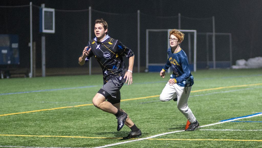 From+left%2C+senior+Elliot+Mintz+and+first-year+student+Thomas+Cronin+run+a+drill+during+a+practice+for+the+Ithaca+College+Men%E2%80%99s+Club+Ultimate+Frisbee+Team+on+Feb.+23+at+Higgins+Stadium.