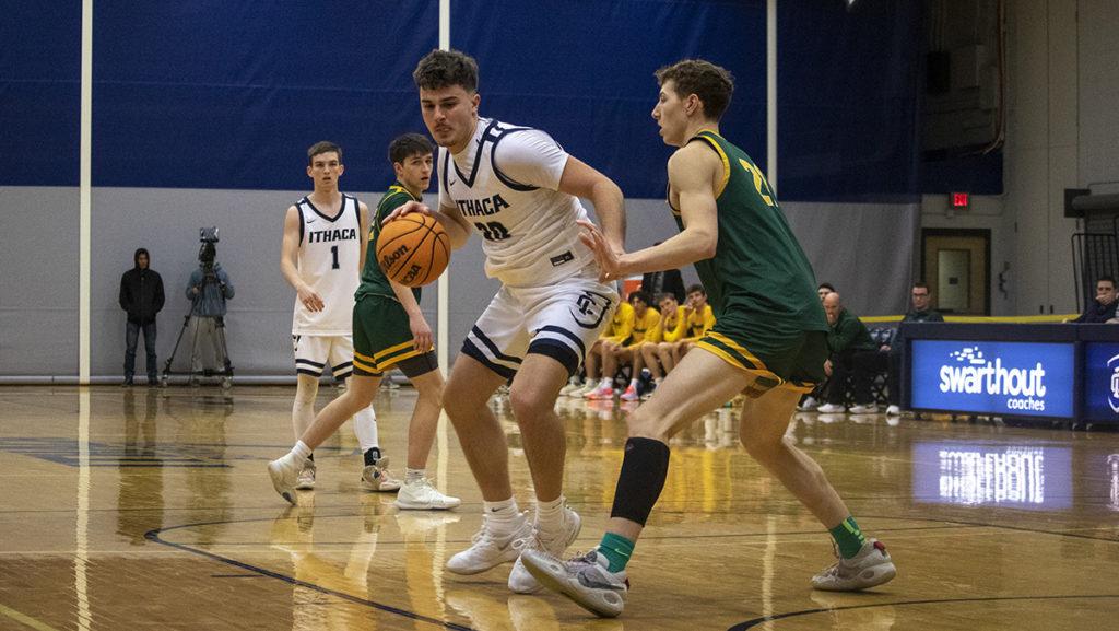 From left, Bombers sophomore guard Logan Wendell watches as his teammate, graduate student forward Luka Radovich, protects the ball from Clarkson sophomore forward Jack Dalgety.