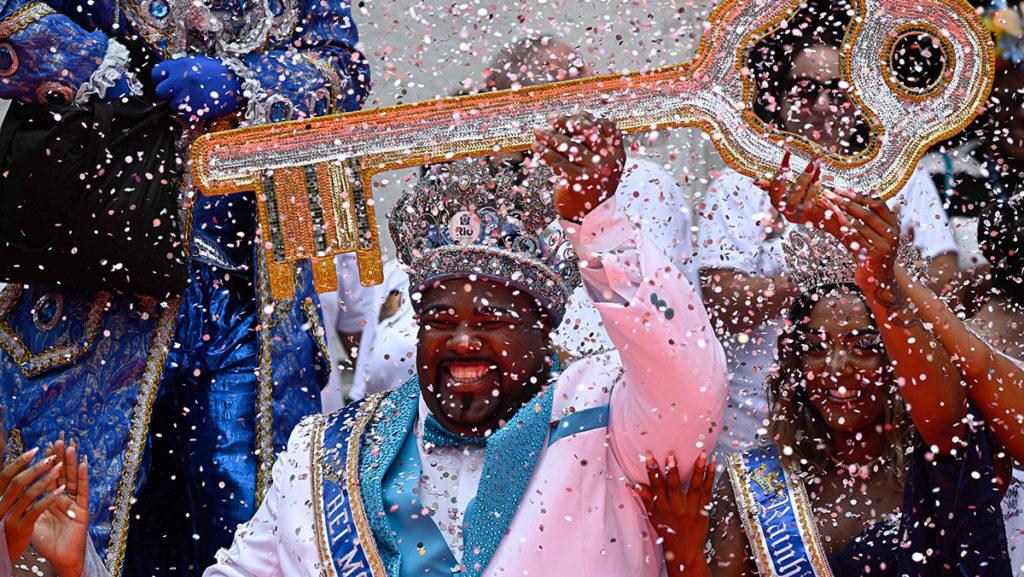 King Momo (the symbol of Carnival) Djeferson Mendes da Silva, 34, holds the keys to the city of Rio during the official Carnival opening ceremony at the City Palace in Rio de Janeiro on Feb. 17, for the first time in two years.