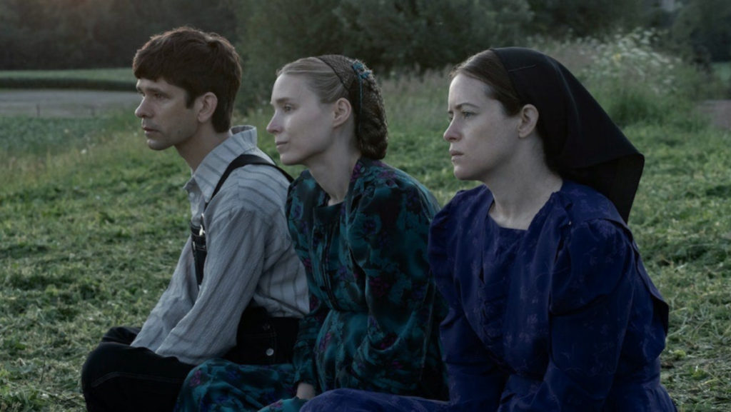 August (Ben Whishaw), Ona (Rooney Mara) and Salome (Claire Foy) reflect on whether or not to leave their colony in Women Talking.