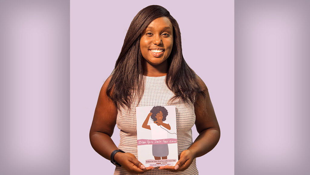 Eden Strachan ’21, author and founder of Black Girls Don’t Get Love, poses with her book, “Black Girls Don’t Get Love.” Strachan hopes to empower Black girls.