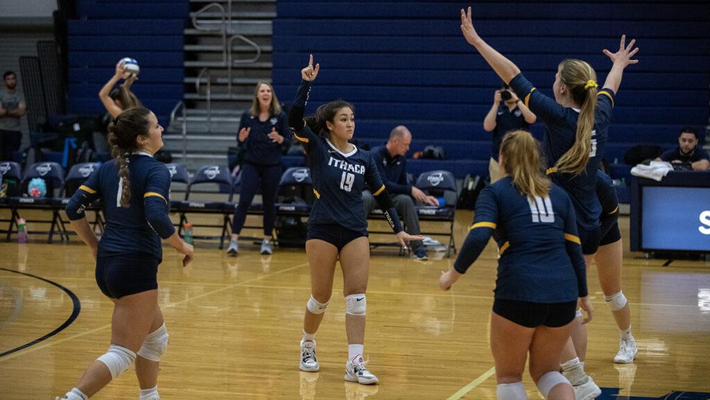 From left, senior Grace Isaksen, first-year student Amanda Zweifler, sophomore Peyton Miller and senior Jennifer Pitts celebrate a point for the volleyball team.