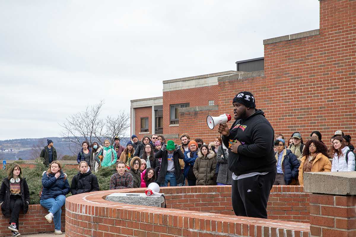 Junior Reward Odilatu delivers a speech about his experiences as a person of color on campus. Ariana Gonzalez Villarreal/The Ithacan