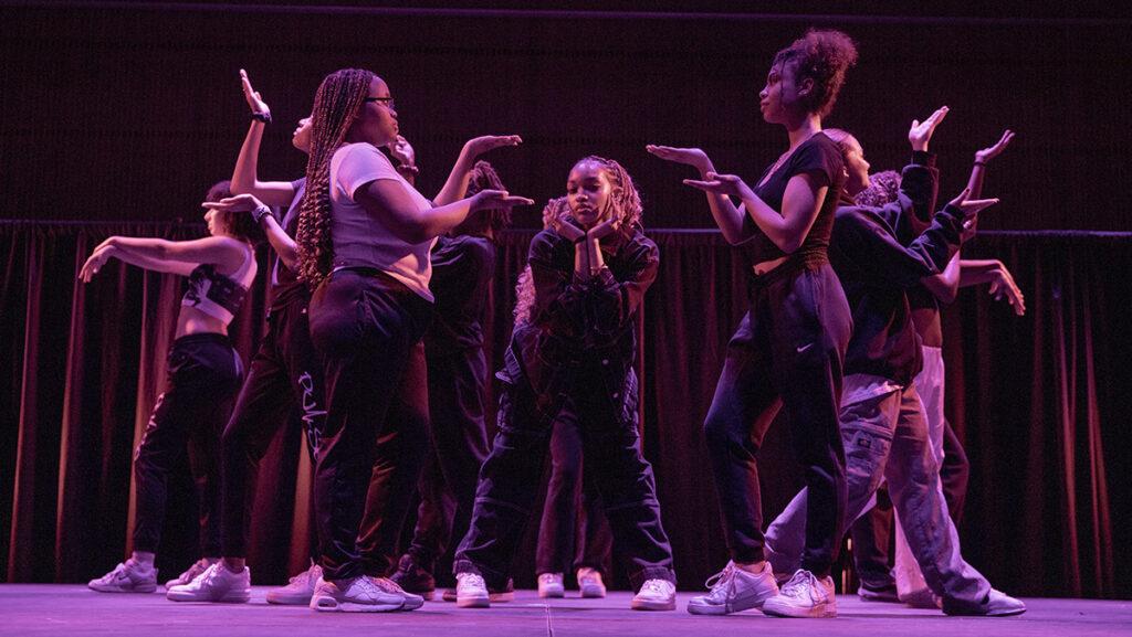 Sophomore Lizelle Hill poses in the middle of the opening to a hip hop routine to “THE Dynasty” choreographed by sophomore Irena Rosenberg and performed by members of the Ithaca College Pulse Hip Hop dance group on March 24 in the Emerson Suites.