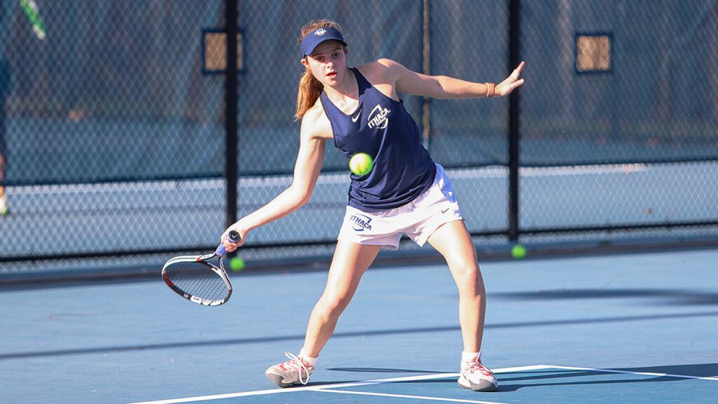 Sophomore Kayla Shenk sends a hit back over the net in the Ithaca College womens tennis teams 5–4 win over William Smith College.