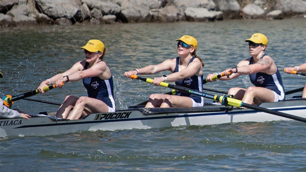 From left, graduate student Allison Arndt, sophomore Lily Babcock and senior Taylor Volmrich, three members of the Ithaca College women’s rowing team’s varsity eight, race on the Cayuga Inlet.