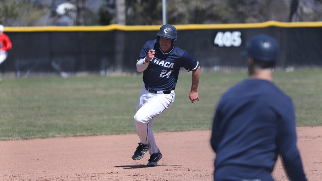Graduate student outfielder Garrett Callaghan runs the bases during the first game of a doubleheader against the St. Lawrence University on April 3. Callaghan returned to the Bombers after competing at the Division I level for a season with Rutgers University.