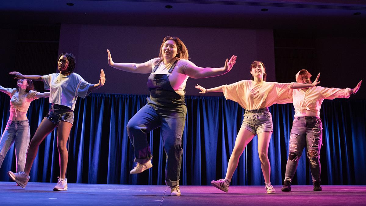 From left, first-year students Sophia Tallman and Leslie Duncan, seniors Tatum Siegel, Gaby Shapiro and Sherleen Vargas perform a routine to the song Blue Orangeade by TOMORROW X TOGETHER. ANA GAVILANES/THE ITHACAN