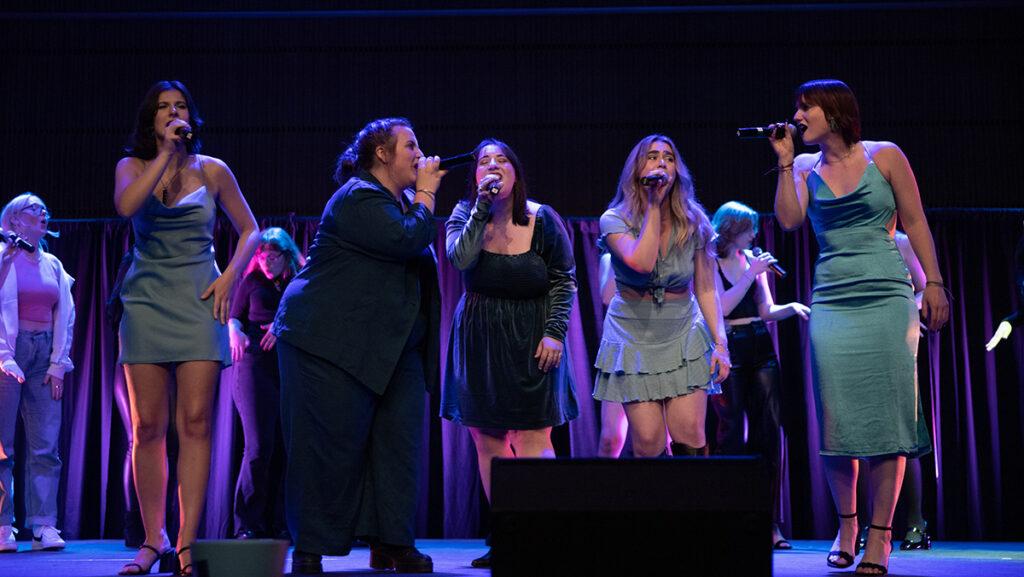 From left, seniors Sammi Frieri, Al Hillebrandt, Hallie Kessler, Delia Vaisey and Em VanWagoner perform one of Premium Blends alumni songs, Alone by Heart, at the end of their Block IV Concert on April 1.