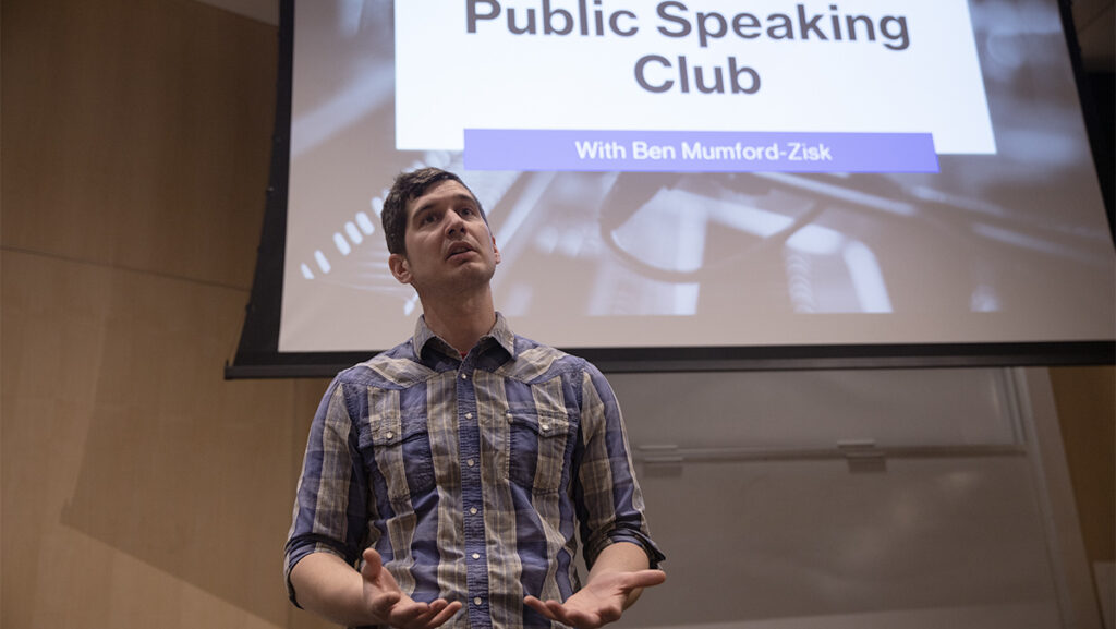 Ben Mumford-Zisk, manager of the Information Technology Student Employment Program, organized a club for students to practice their public speaking skills.