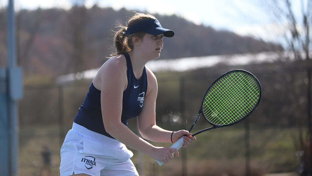 Sophomore tennis player Taylor Crain prepares to return a hit during the Bombers 5–4 win over the William Smith College Herons.