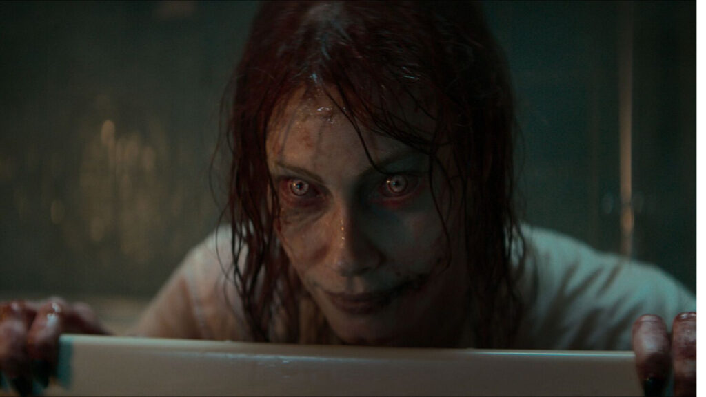 Ellie (Alyssa Sutherland) is taken by the deadeyes in Evil Dead Rise.
