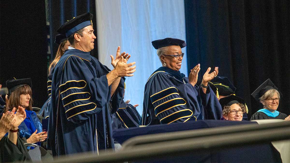 President La Jerne Cornish and David Lissy ’87, chair of the Board of Trustees, clapped for Francesca Infante-Meehan at the end of her speech to her graduating peers. MALIK CLEMENT/THE ITHACAN