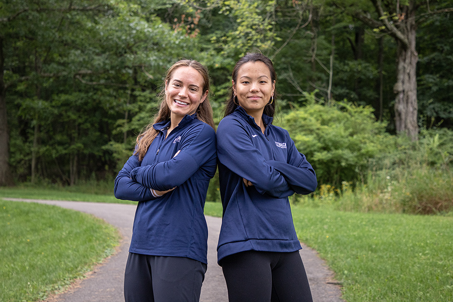 From left, graduate students Paloma De Monte and Julia Tomanovich opted to return to the Ithaca College women’s cross sountry team after competing as athletes for five and four years, respectively.