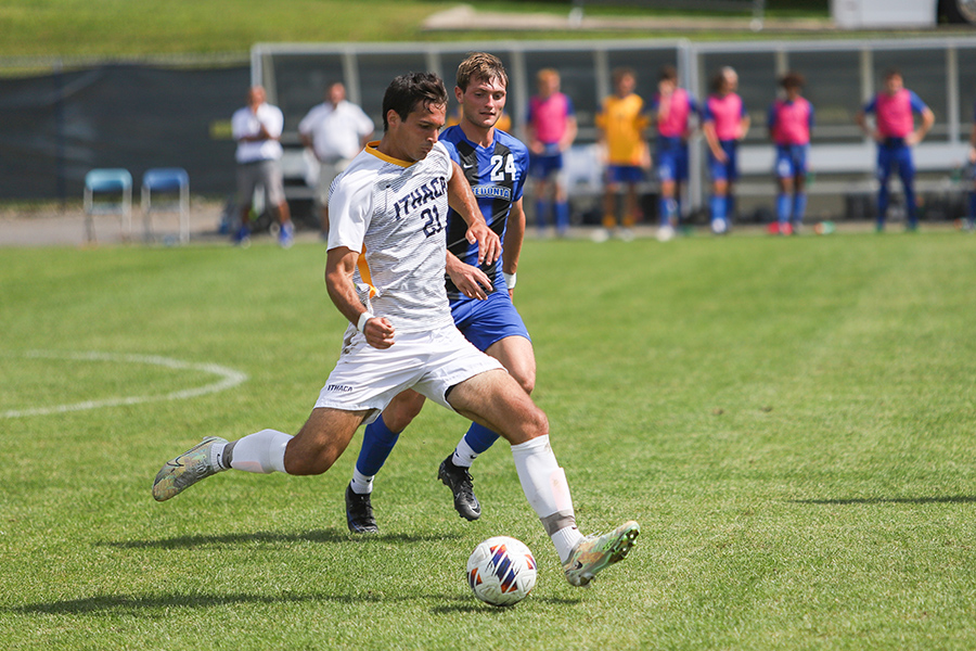 From left, Bombers graduate student defender Brendan Lebitsch looks to push the ball down field with junior forward Kaleb Steward trailing.