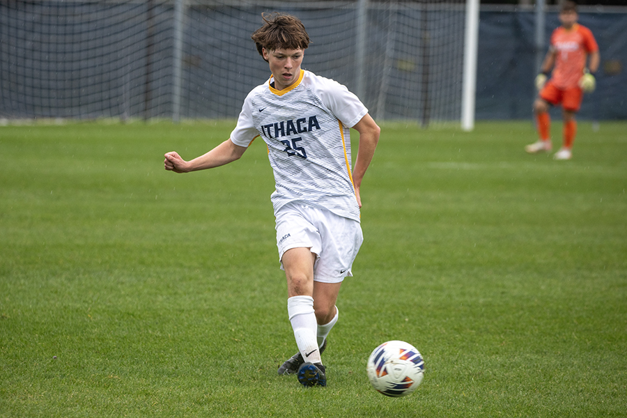 First-year midfielder Colin Adams looks to advance the ball in the Bombers 2–0 loss to Hobart College Sept. 27.