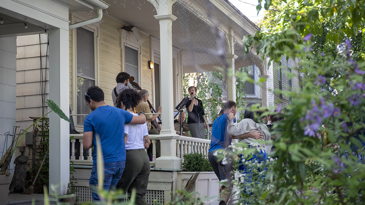 The Diana Leich quartet performs at Porchfest on Sept. 25, 2022 as crowds of people walk by, taking in the sound of various music genres from different porches.