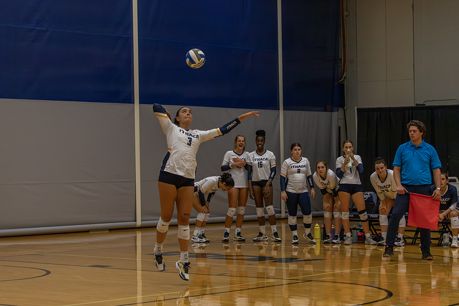 Senior middle hitter Jamie Koopman prepares to serve during the Ithaca College volleyball teams 3–0 sweep over Susquehanna University.