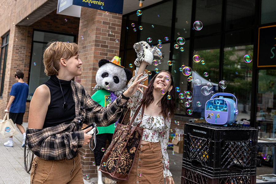 From left to right, Aura Page and Margaret Fraser experience all there was at the Welcome Student Weekend, from visiting shops to popping bubbles. 