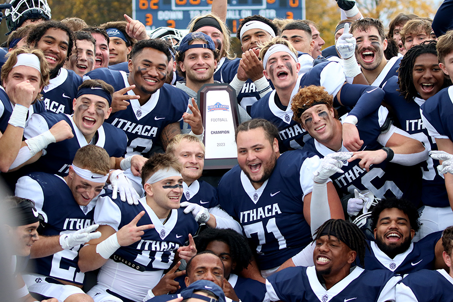 Bombers football players celebrate their Liberty League title clinching  62–0 victory over Buffalo State at midfield. The game marks the second straight Liberty League title for the Bombers and broke the school record for total yardage in a game with 686.
