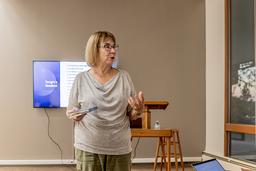 Barbara Adams, associate professor in the Department of Writing, describes the book she chose to read from at the Banned Books event on Oct. 3. Students, faculty and staff gathered in the Gannett Center to read banned books and discuss ways to combat censorship. 