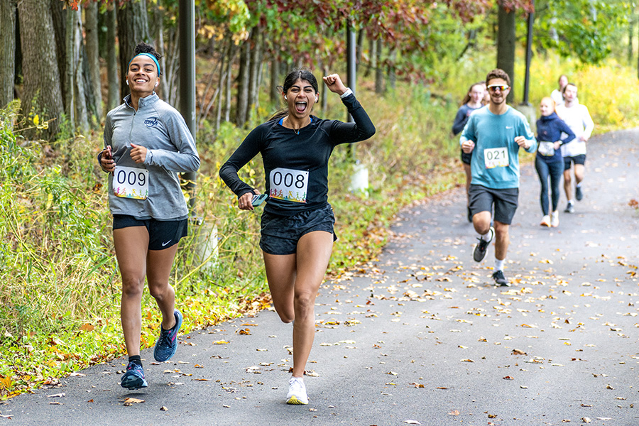 From left, junior journalism major Carolina Cedraschi and junior clinical health studies major Ashna Kalvani compete in the physical therapy programs Bomber Blitz 5K. Every year, the Ithaca College Department of Physical Therapy holds the 5K to raise research funds for the PT program.