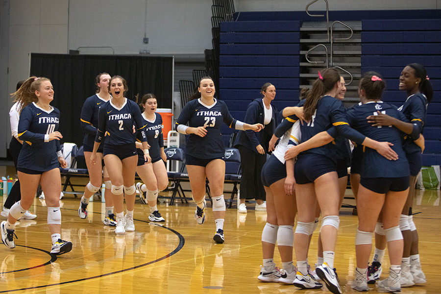 The Ithaca College volleyball team runs on to the court to celebrate its four set victory over the University of Scranton. The victory is the sixth straight for the Bombers.
