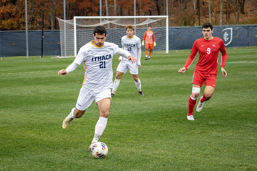 From left, Bombers graduate student defender Brendan Lebitsch winds up to send the ball downfield as sophomore defender Jack Walker and Engineers senior forward Kyle Osborne look on.