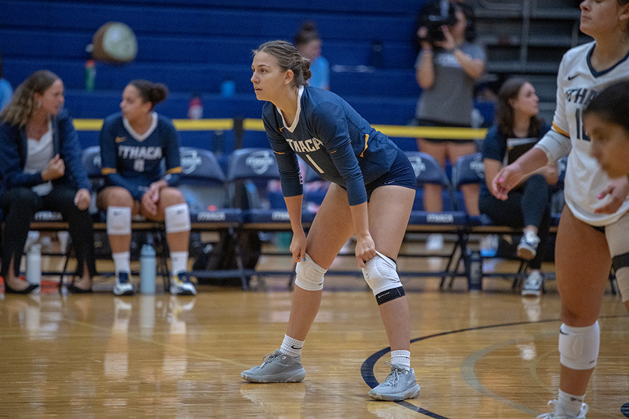 Junior defensive specialist Ellie Benedict prepares to receive a serve during the Bomber Invitational, a home-opening tournament hosted Sept. 15–16 in the Ben Light Gymnasium.