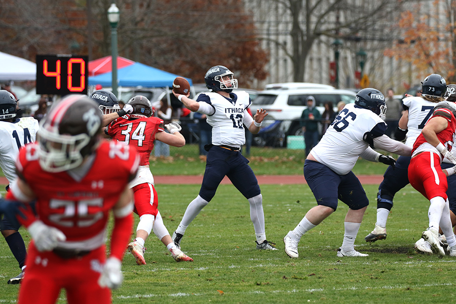 Bombers first-year quarterback Colin Schumm loads up in the pocket to send the ball downfield in the Bombers 51–14 win over St. Lawrence University Nov. 4.