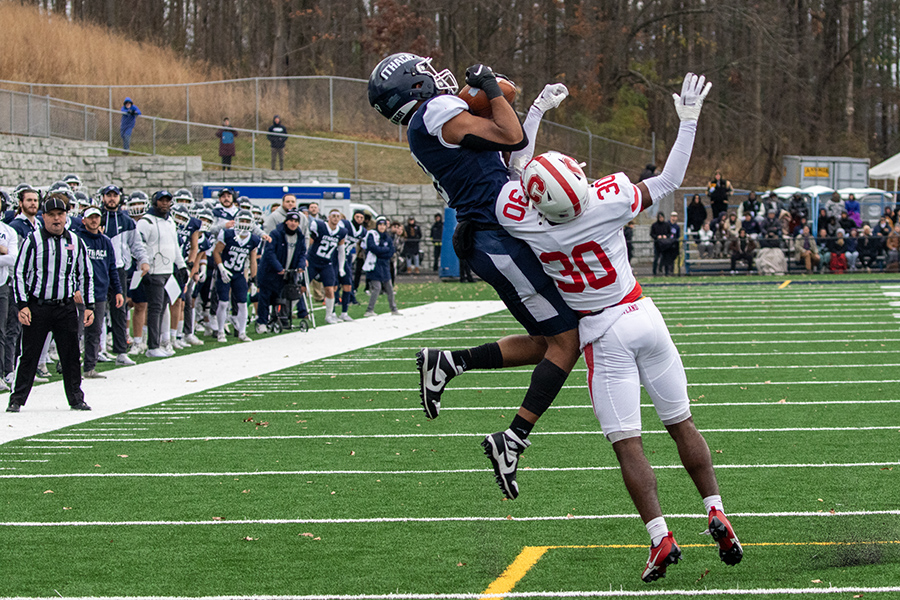 Graduate student wide receiver Julien Deumaga goes up and secures a big reception over first-year defensive back Naz Jean-Lubin.