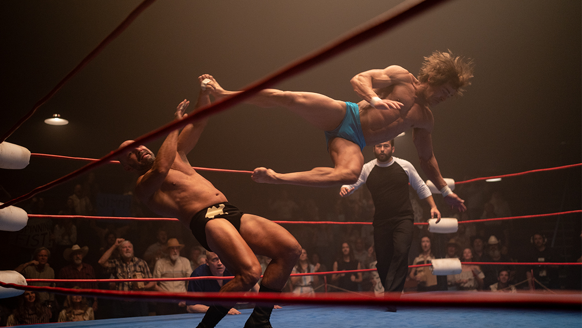 The Sheik (Chavo Guerrero Jr.) and Kevin Von Erich (Zac Efron) face off in the ring in A24s film The Iron Claw.
