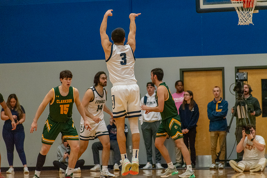 Junior guard Aidan Holmes puts up a jump shot in the Bombers 93–86 victory against the Clarkson University Golden Knights on Feb. 10.