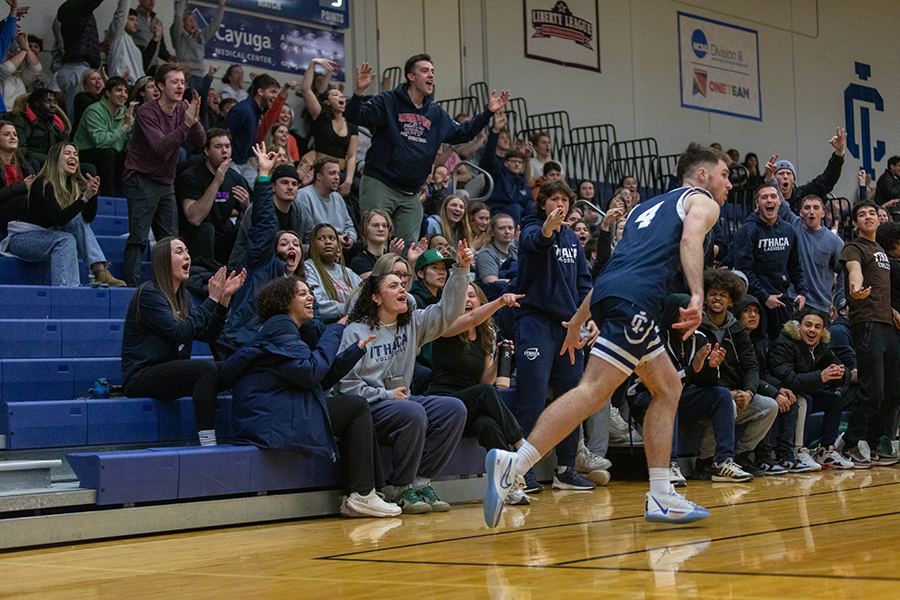 The Bombers student section cheers on senior Andrew Geschickter after he makes a corner 3-point shot.
