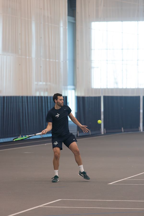 Senior Jacob Wachs prepares to hit the ball back to his opponent. The 2024 Ithaca College mens tennis season is under way with promising first-year students and new coaching staff.