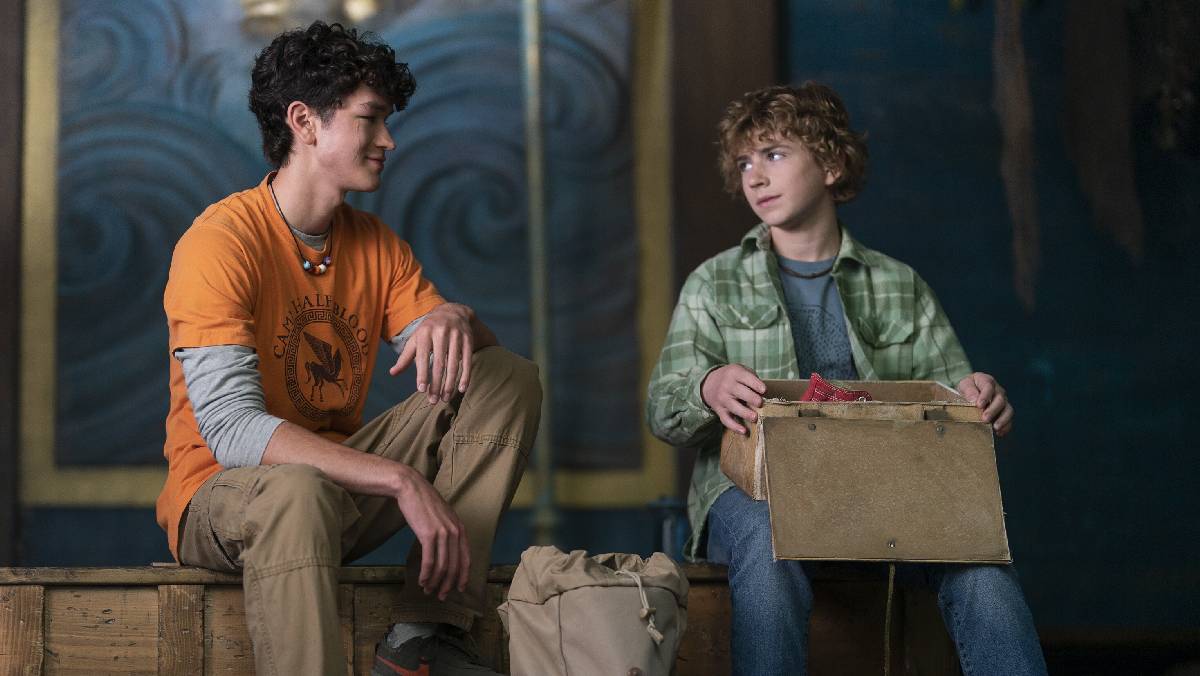 Luke Castellan (Charlie Bushnell) gives Percy Jackson (Walker Scobell) his pair of winged shoes that had been given to him by his father, Hermes.