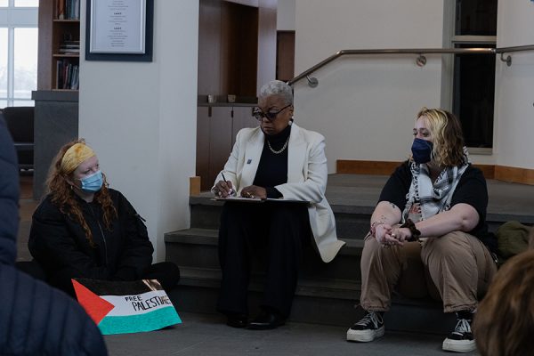 President Cornish sits with Fireside and other students who participated in the die-in to listen to the group’s demands for administration on campus. 
