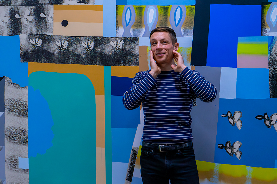Will Hutnick stands with his new solo exhibition, 