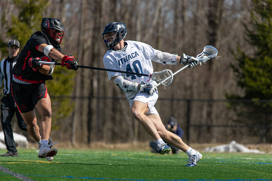 Senior attackman John Sramac attempts to dodge around an Engineer defender in the Bombers 10–9 loss on March 30. Sramac had two late game goals in the matchup and cut the deficit to one goal with 5:44 remaining.