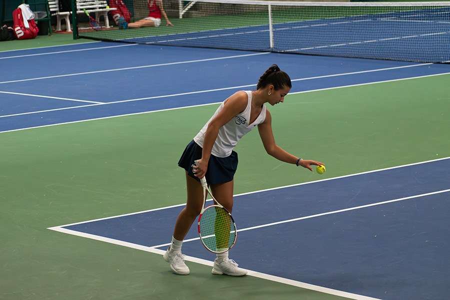 Sophomore Sabrina Cheung gets ready to serve the ball against her opponent in the Bombers 3–6 loss against the Engineers. The South Hill Squad will face the William Smith College Herons next.