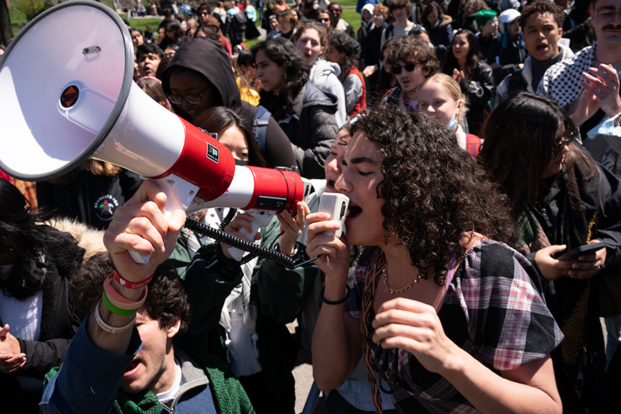 Student protestors chant disclose, divest, we will not stop, we will not rest at Cornell University on April 25.