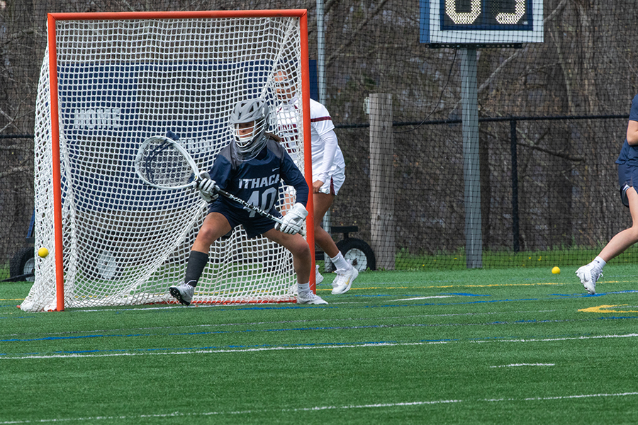 The Ithaca College womens lacrosse team runs across Higgins Stadium with smiles. The Bombers extended their win streak to 10 games with an 18–3 victory over the Vassar College Brewers on April 19.