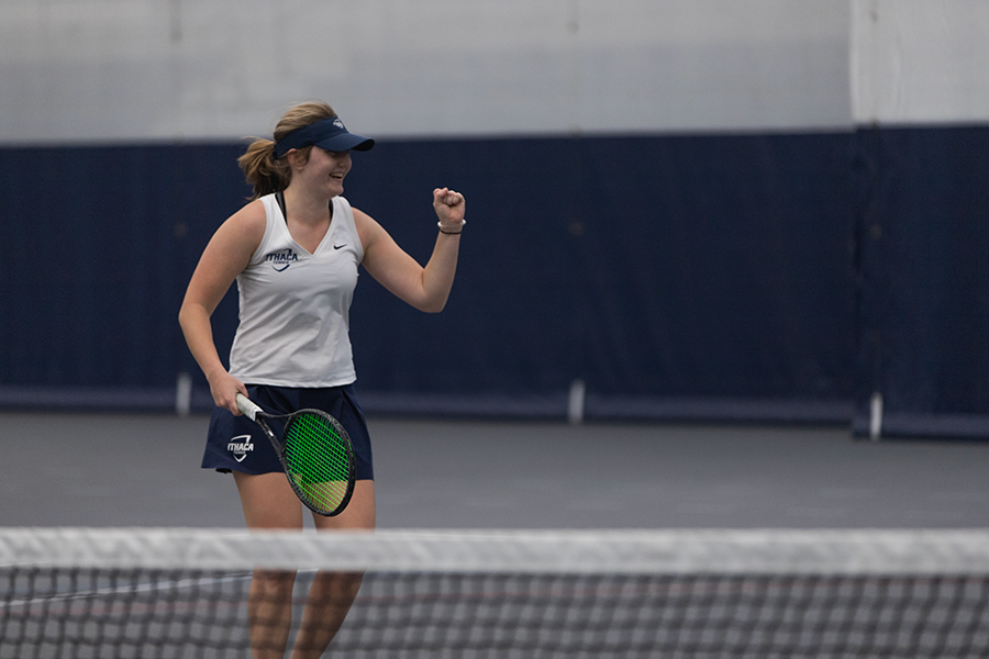 Junior Taylor Crain celebrates after winning a point against Clinard and Kronenberg in the Bombers 5–4 victory against the Rochester Institute of Technology Tigers on April 10.