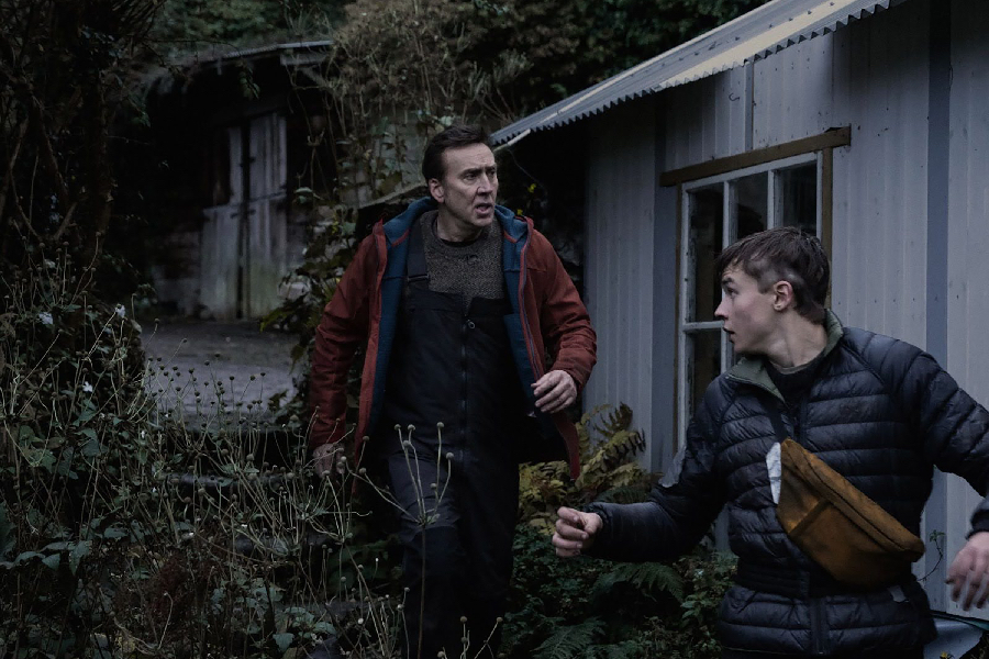 Paul (Nicolas Cage) and one of his sons, Thomas (Maxwell Jenkins), fight to survive on Earth after most of the population has been wiped out in Arcadian.