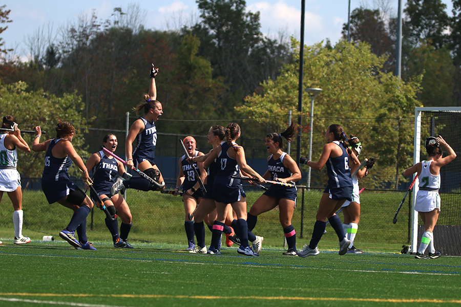 The No. 17 Ithaca College field hockey team celebrates its 1-0 victory over the No. 9 York College of Pennsylvania Spartans. Senior midfielder Meara Bury scored a goal early in the game to send the Bombers past the Spartans.