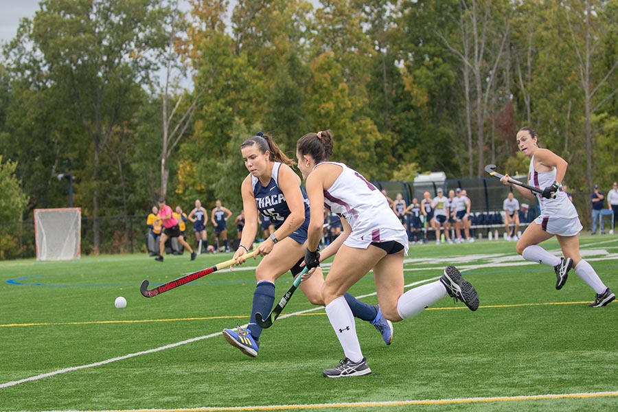 Senior defender Bella McCollister battles for the ball during the Ithaca College field hockey team's win over Union College on Sept. 28. On Oct. 5, the Bombers fell to the William Smith College Herons, 2-1.