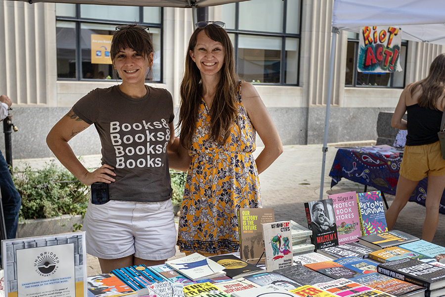 From left, Rachel Crawford and Amanda Flannery run their combined table on The Commons for Akimbo Bookshop and Unabridged Literary Arts. Crawford spoke at a panel on Sept. 13 that discussed the challenges of owning an indie bookstore. 