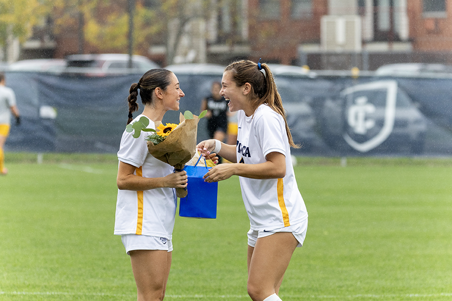 From left, senior forward Rachel Hersch and junior forward Ava Detorie share a bonding moment on Senior Day.