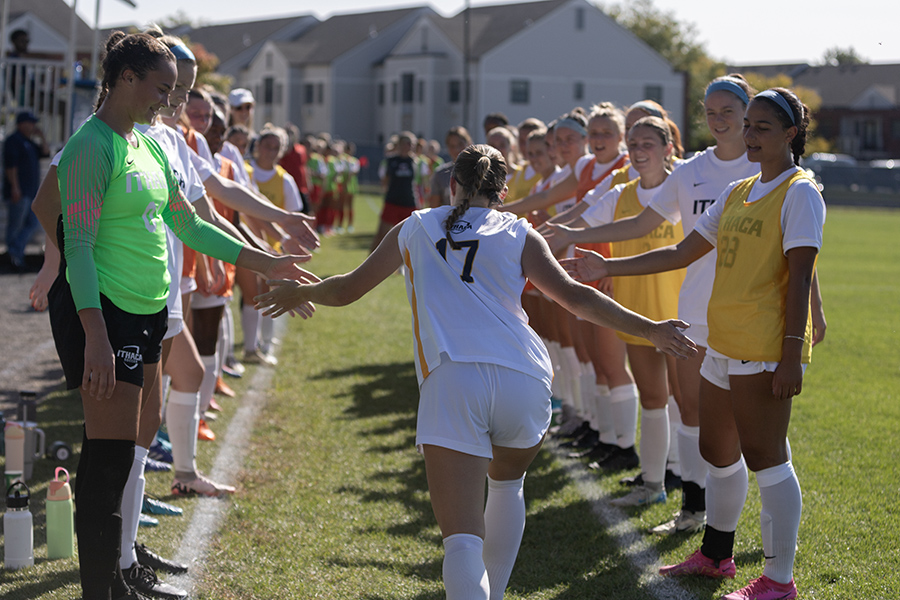 Sophomore midfielder/defender Zara Nourie runs to high-five her teammates in the Bombers' 2–0 victory over the Red Dragons. Graduate student midfielder Sarah Sinnott led the South Hill squad with both goals.